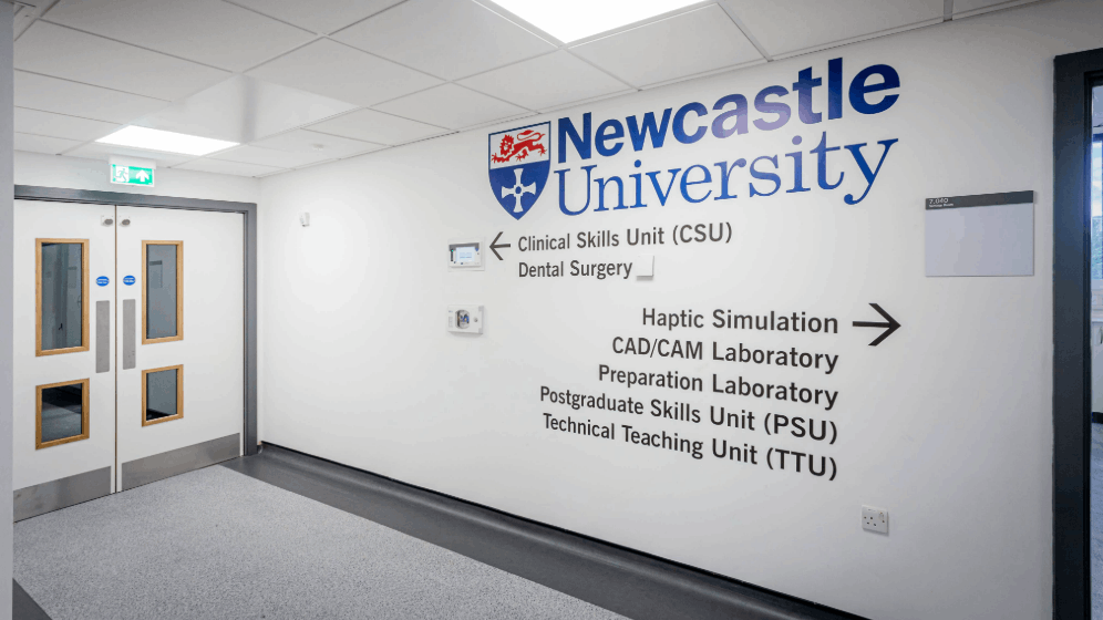 clinical facilities corridor with university sign